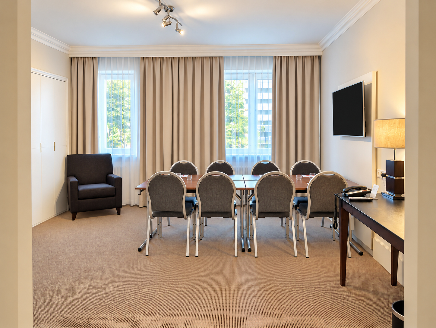 Conference room with armchairs and chairs