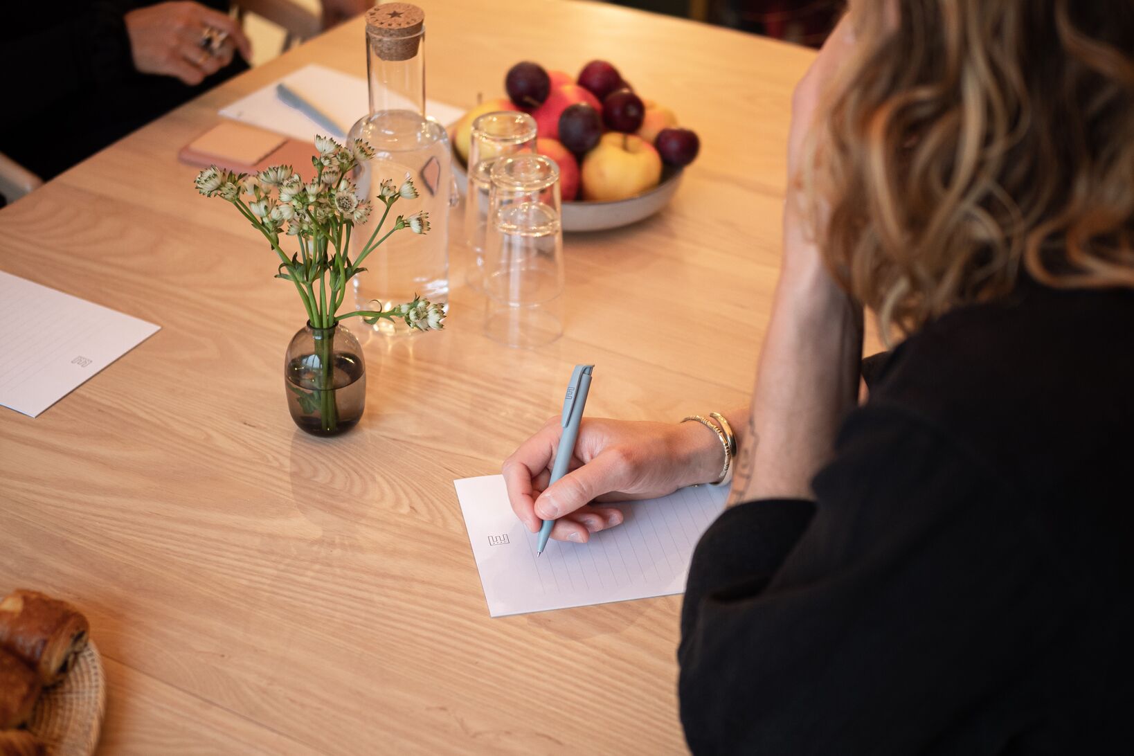 Conference room with a person taking notes