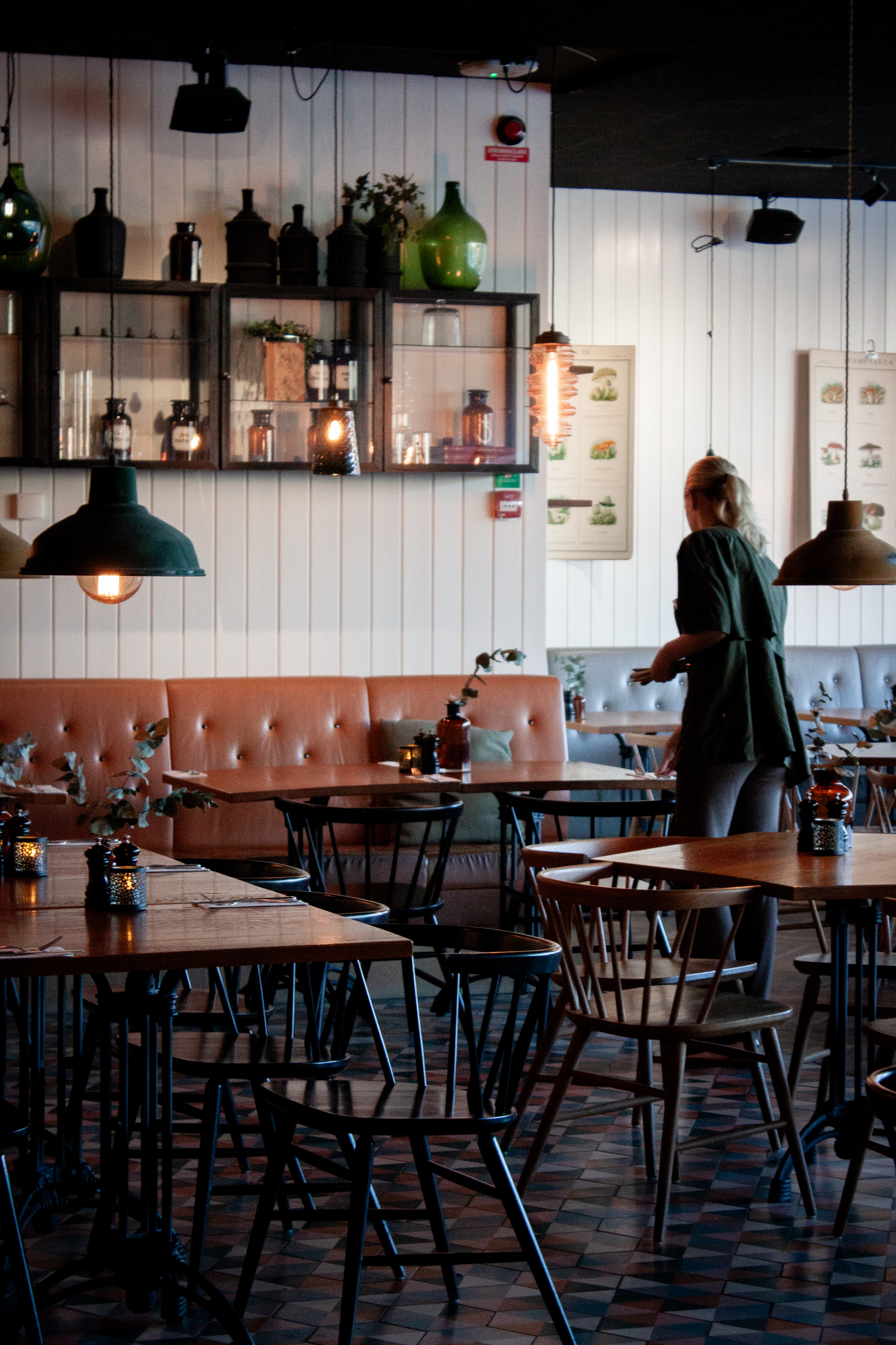 Two dishes served in a restaurant with wooden chairs