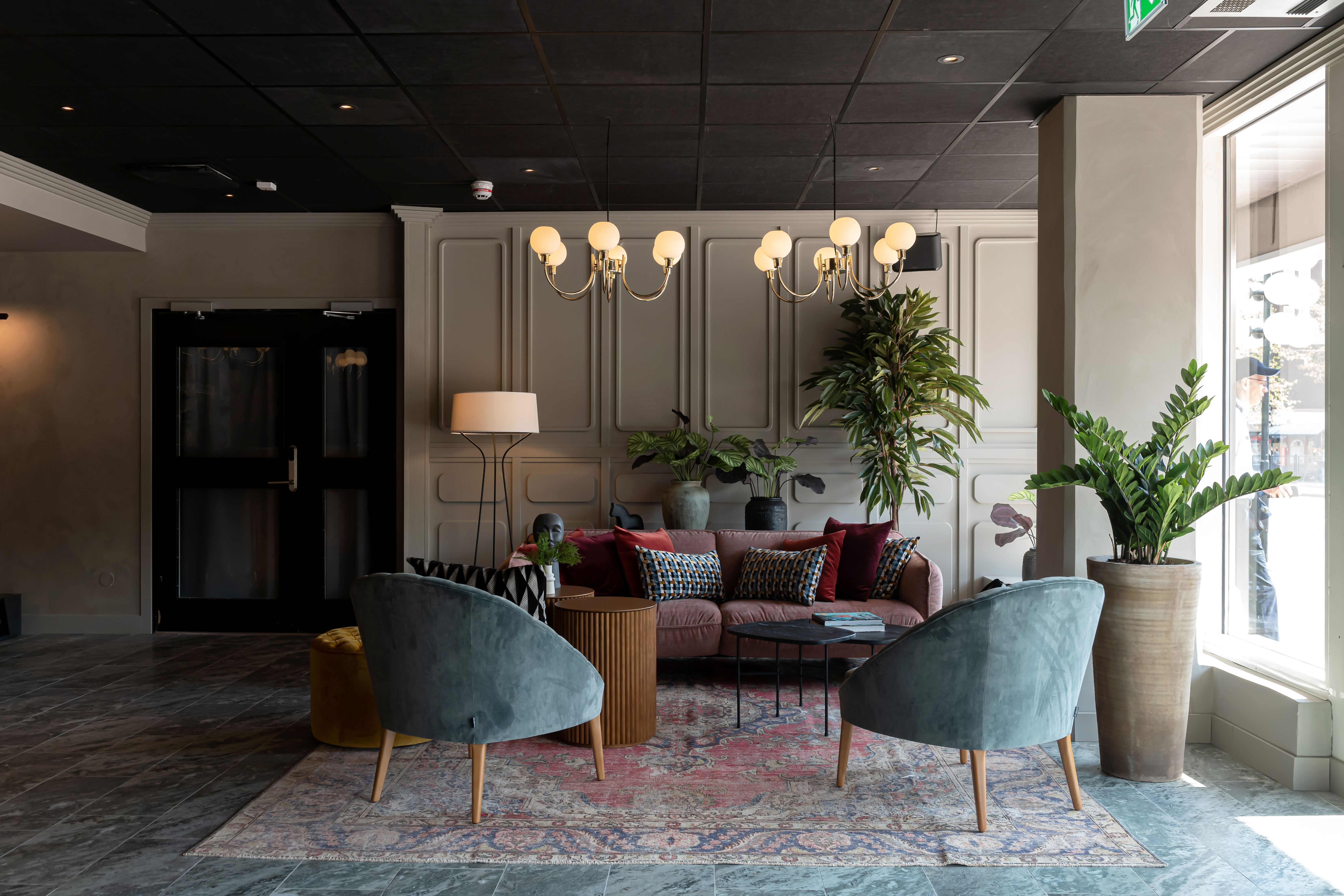 Hotel lobby with lounge furniture and plants