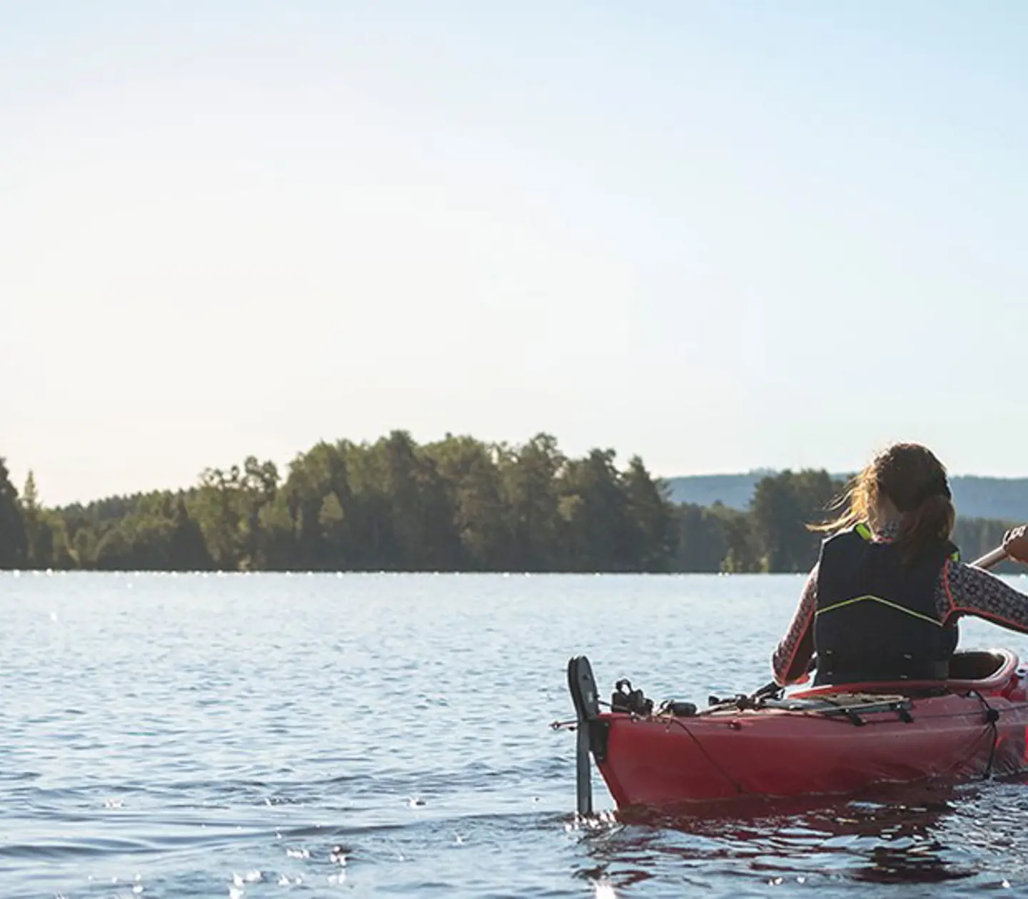 Woman in kayak in summer