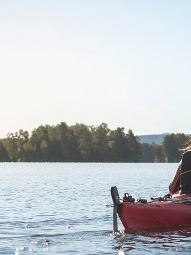 Woman in kayak in summer