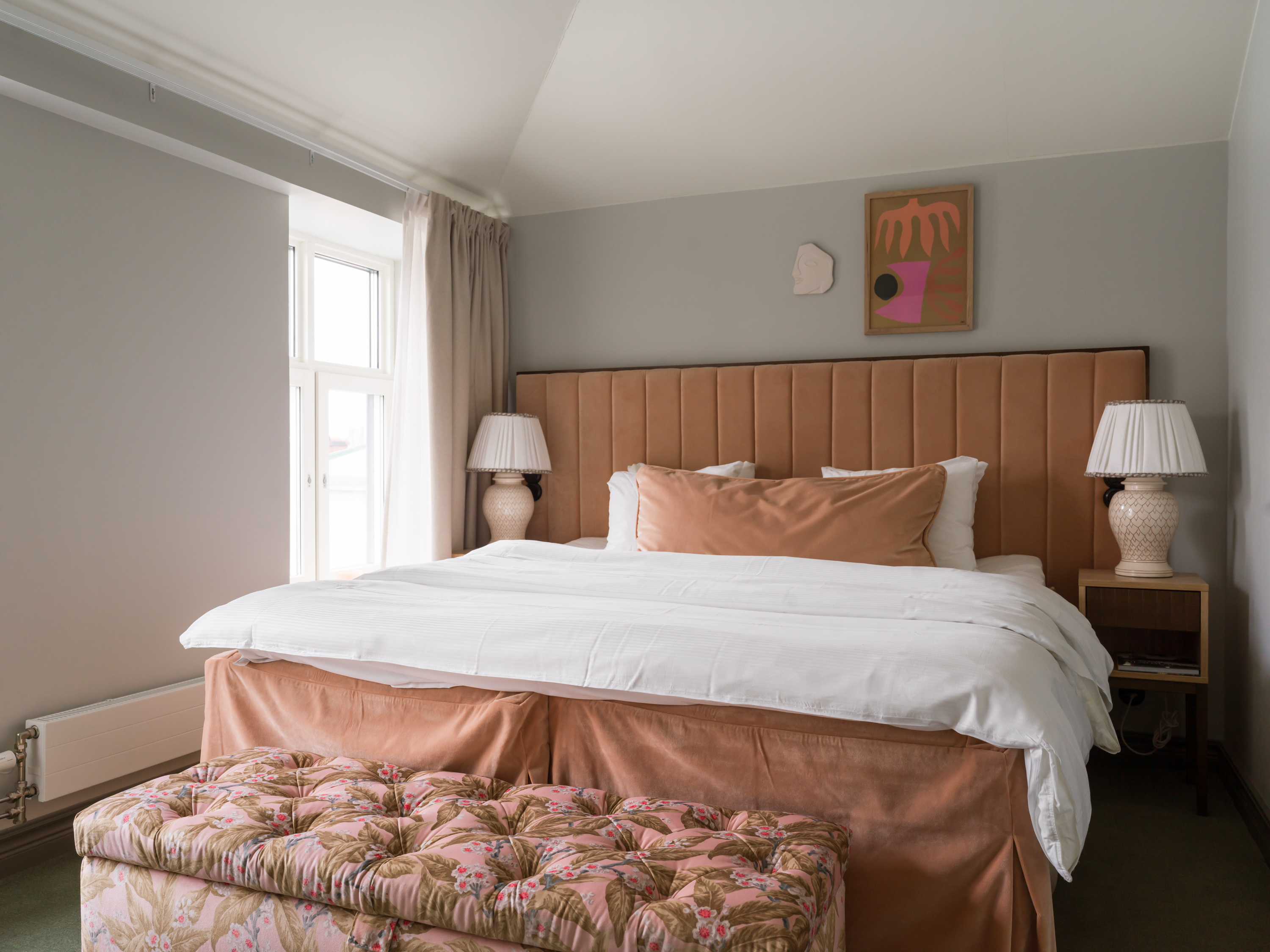 Bed with chair in front of it