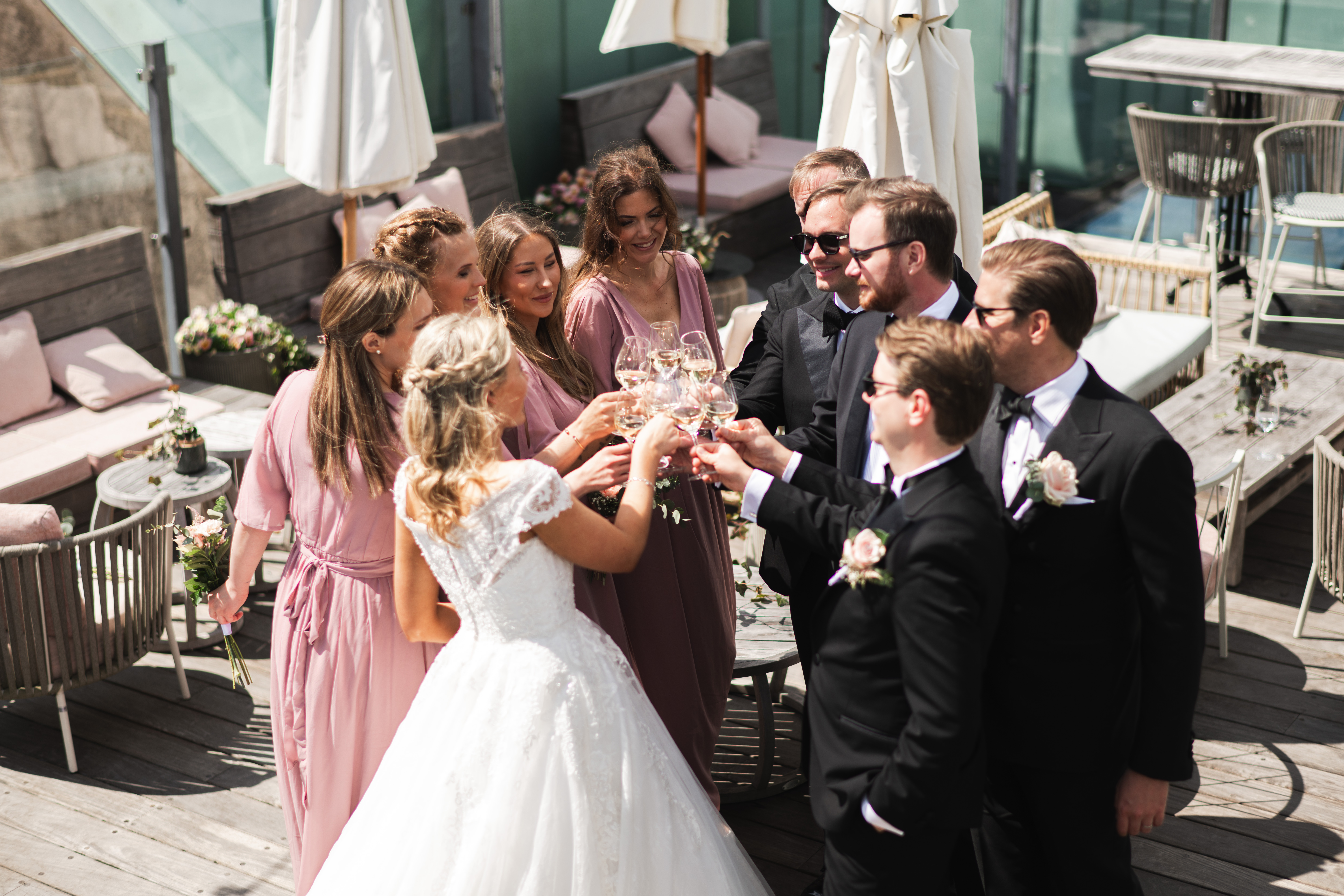 Silhouetted couple kissing at sunset with sunflare highlighting the bride's veil.