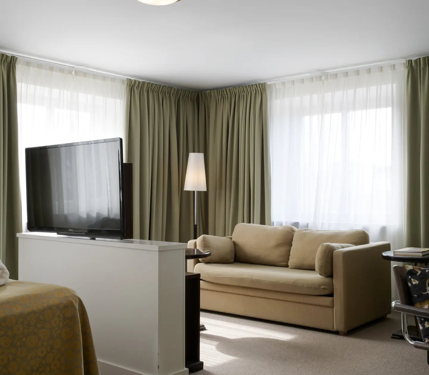 Suite with TV, seating area and large windows