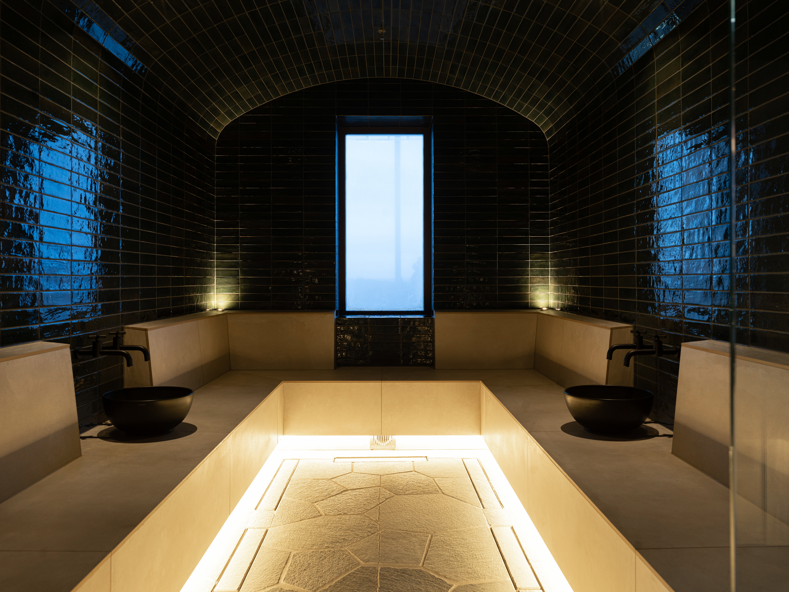 Spa environment with pool and sauna in the background