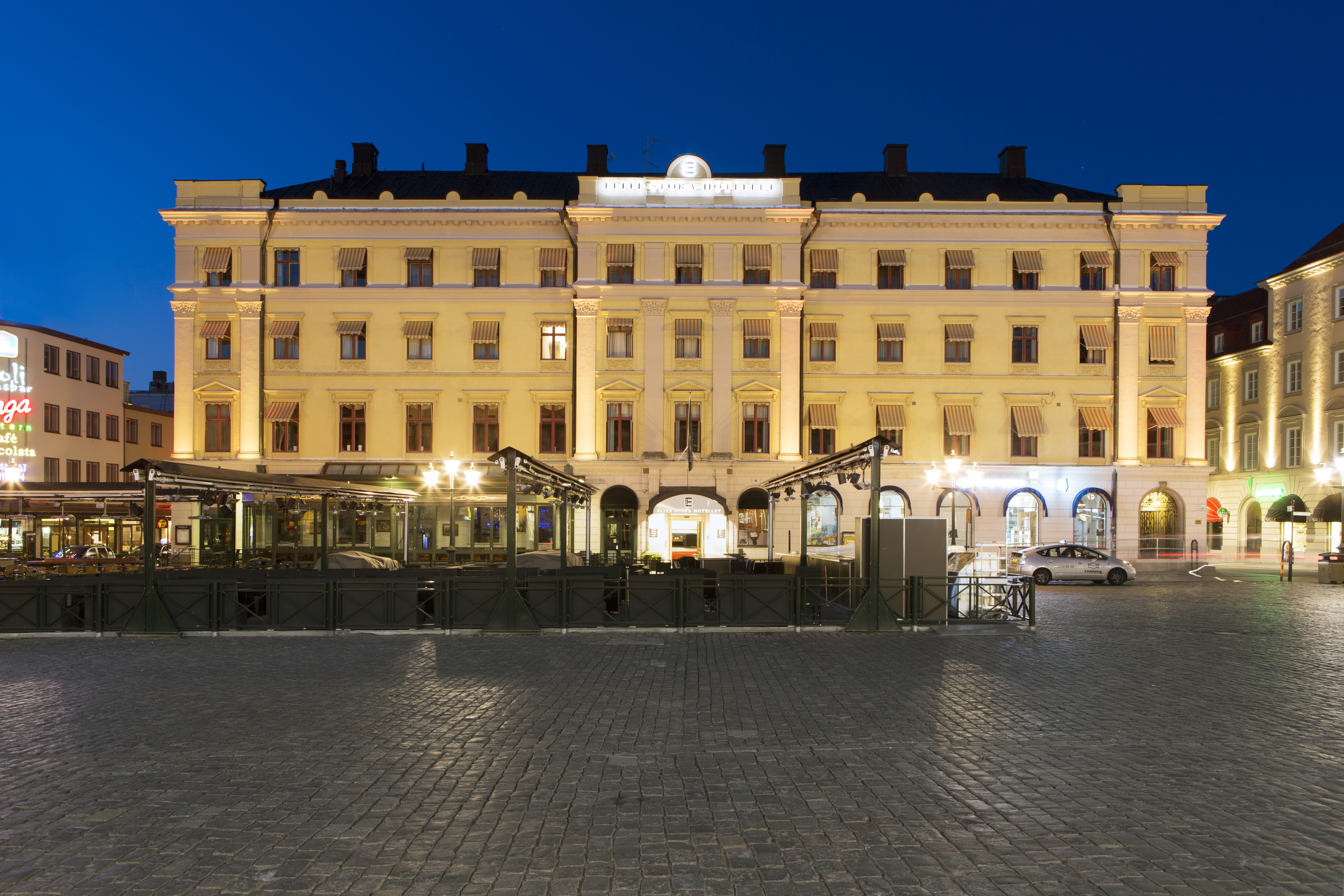 The grand facade of the Elite Stora Hotellet at dusk