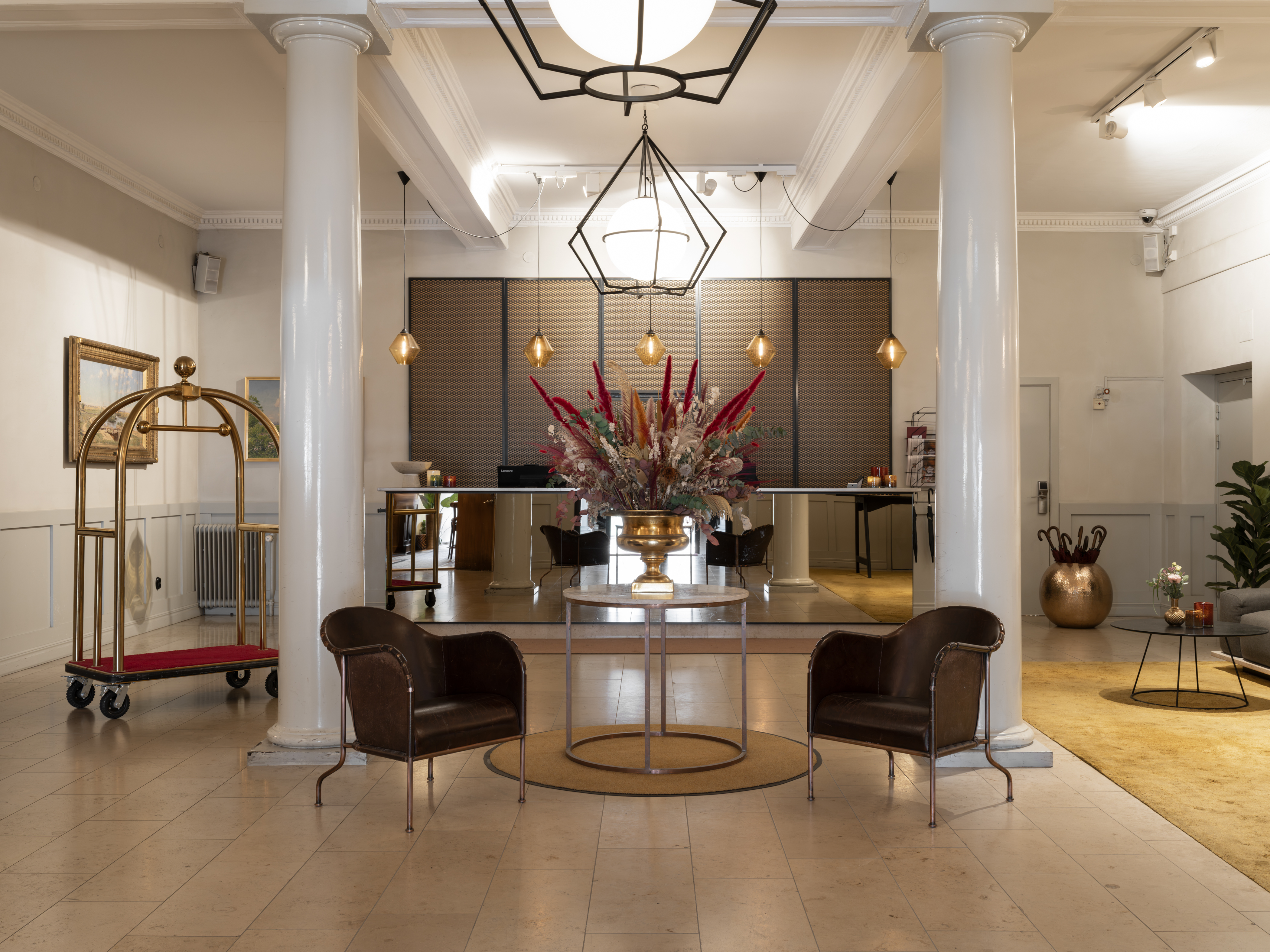 Elegant hotel lobby with columns and chandelier