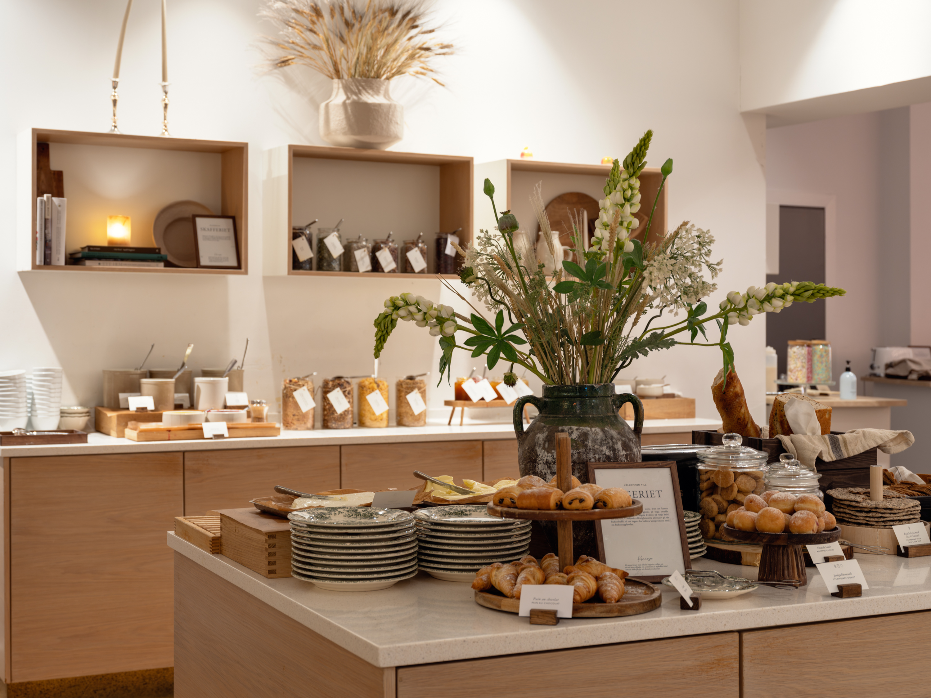 Bakery buffet with flowers and pastries