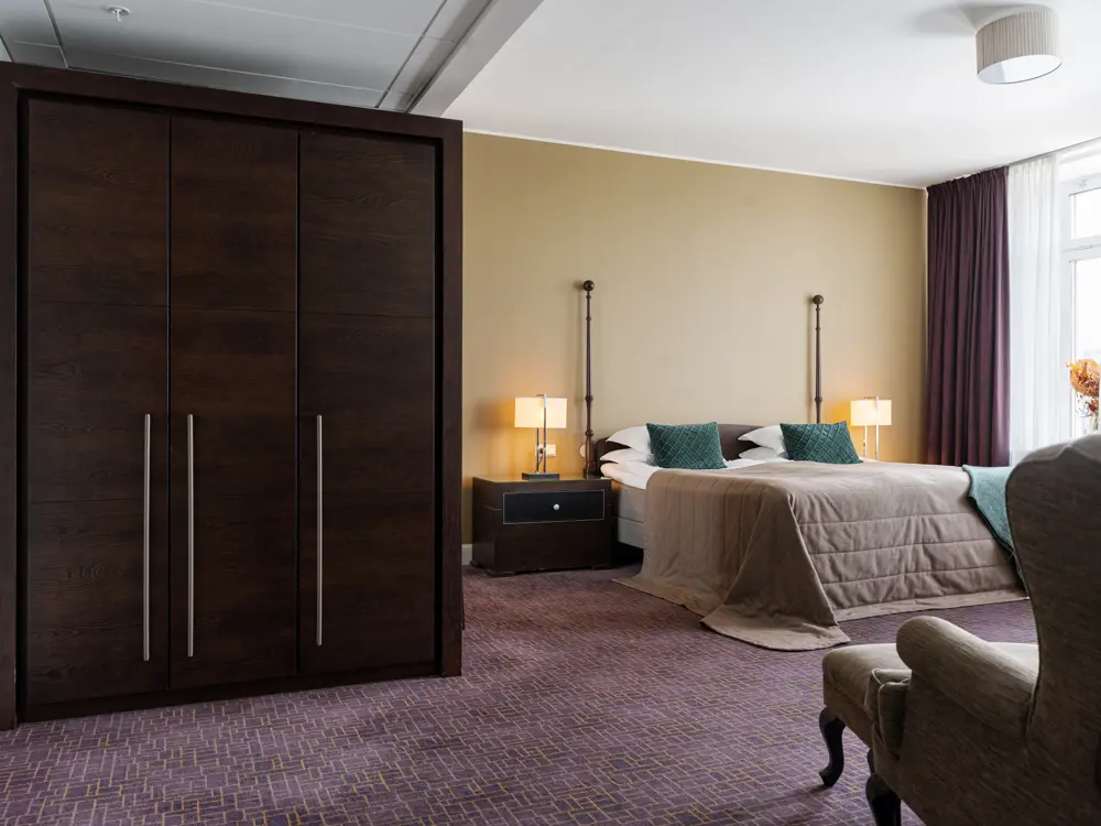 Cozy suite with sofa group, armchairs and window