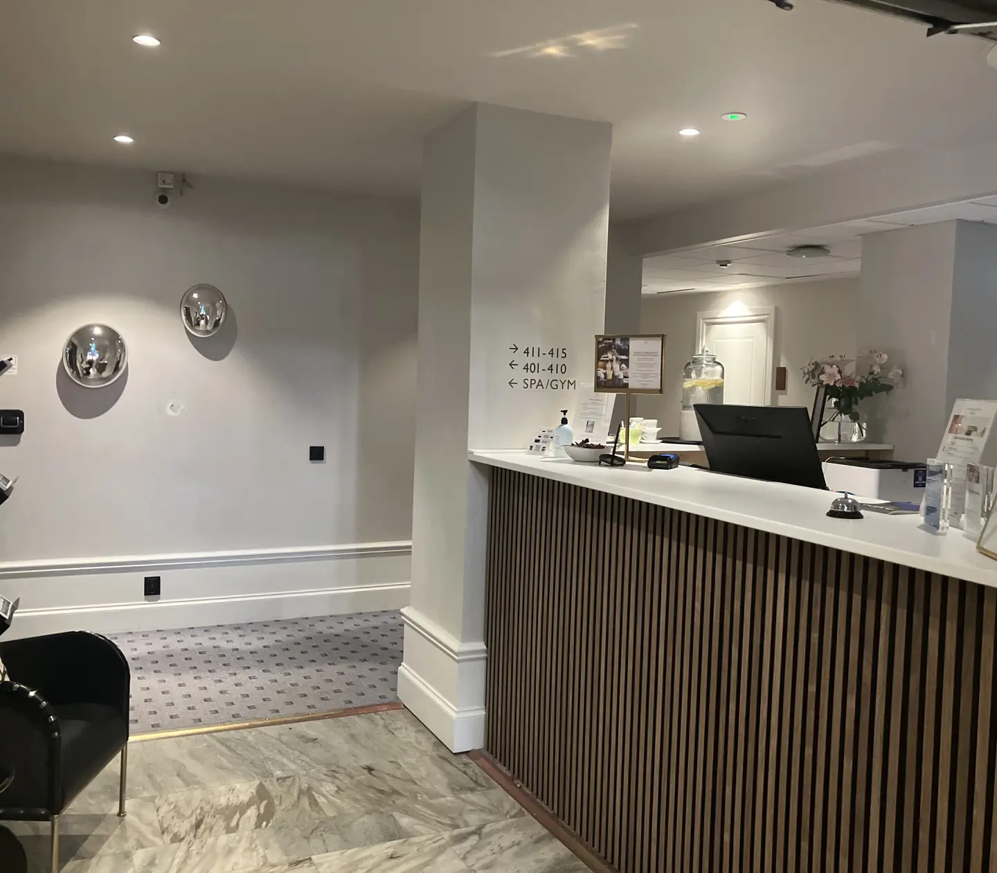 Reception counter with large flower bouquets