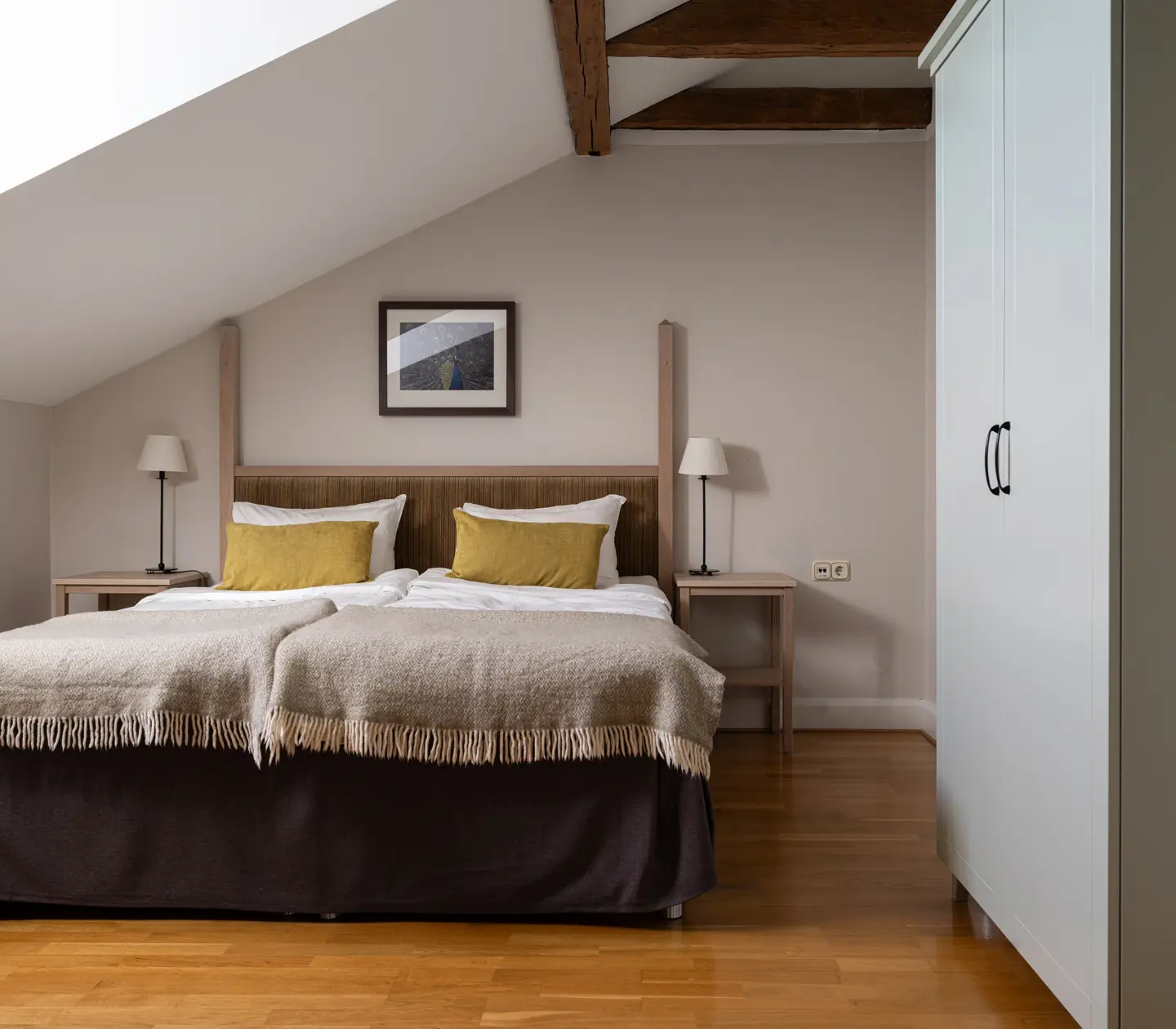 Hotel room with double bed, armchair and window