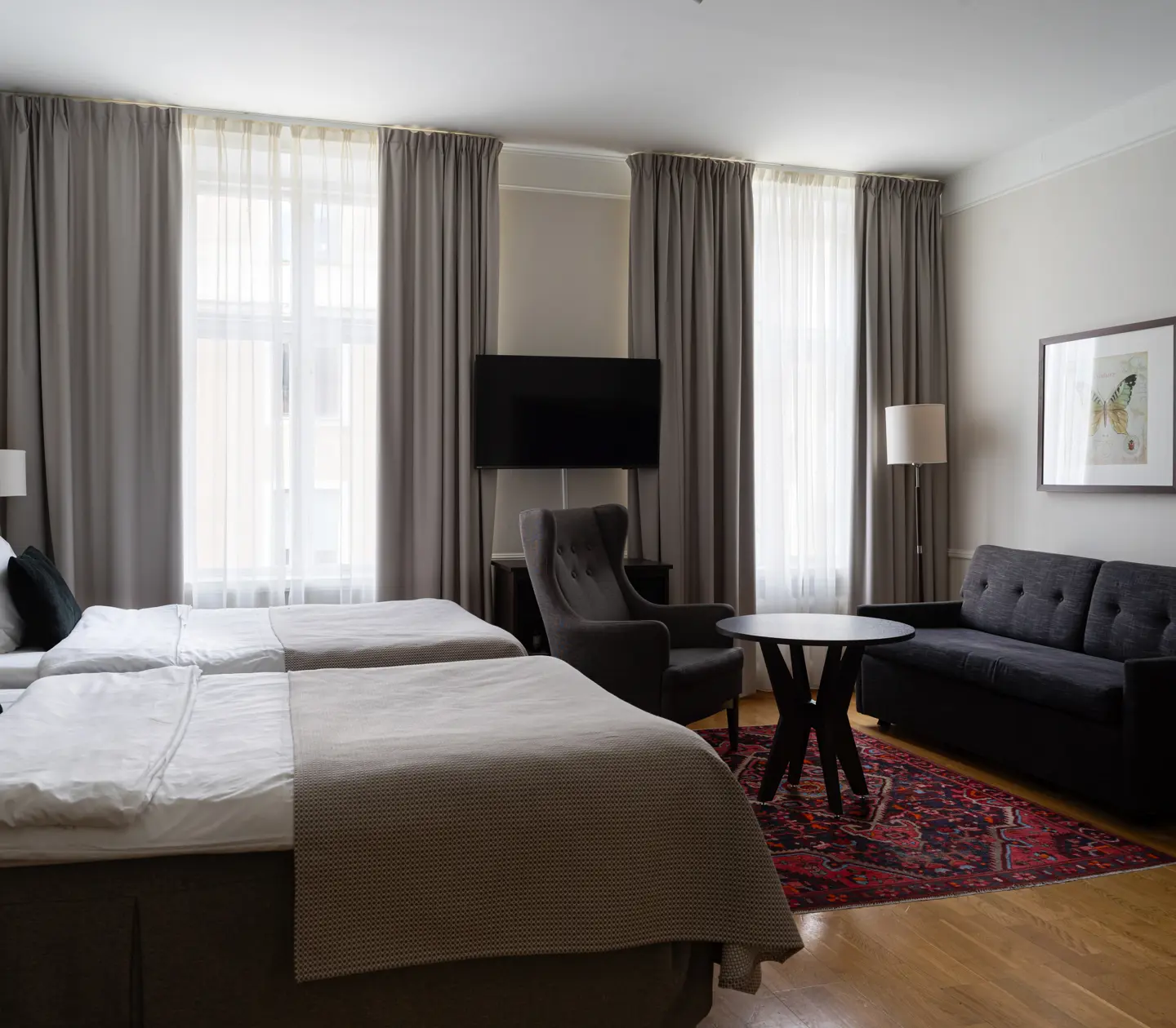 Double bed, armchairs, desk and window