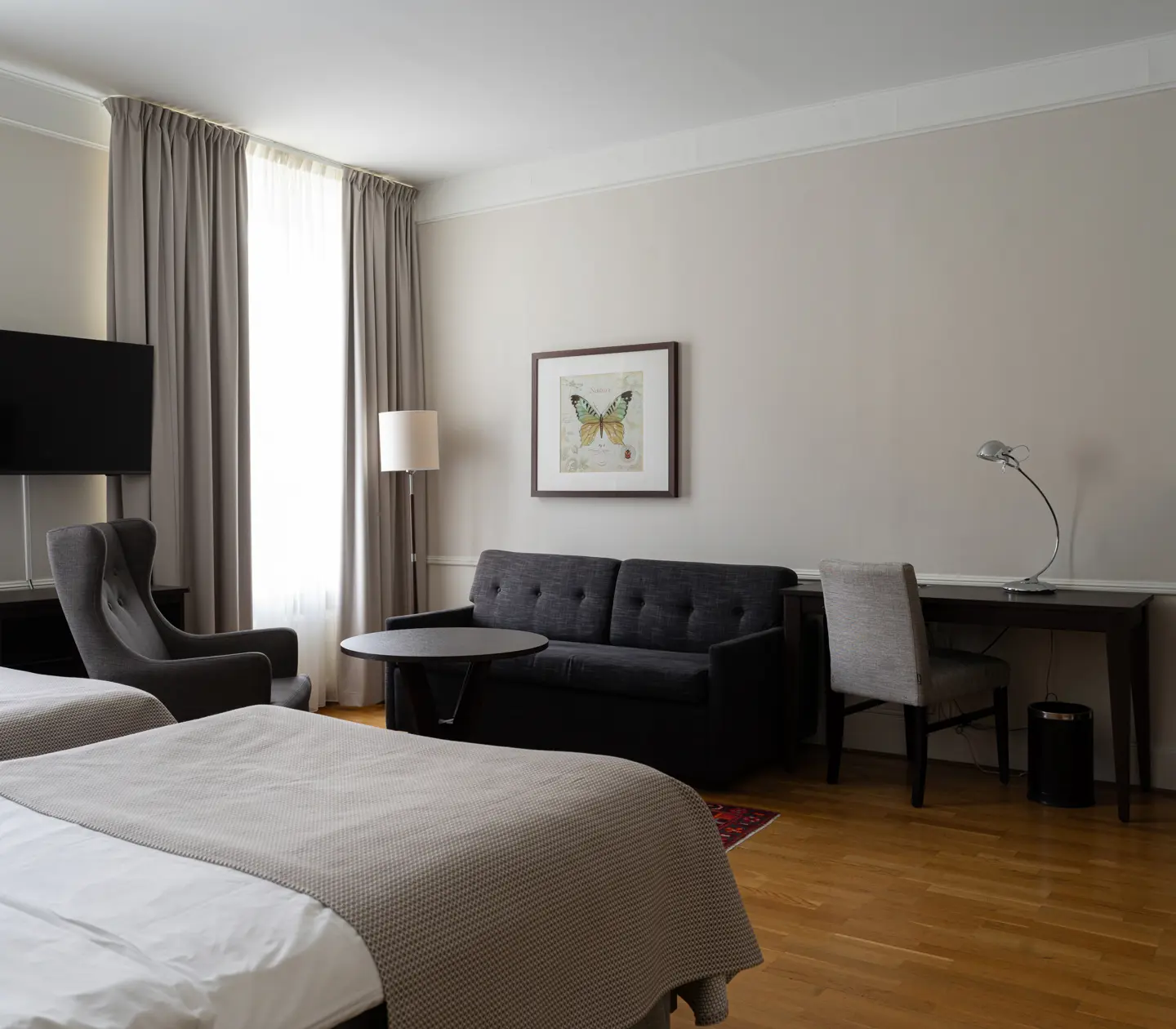 Double bed, desk, armchairs and TV