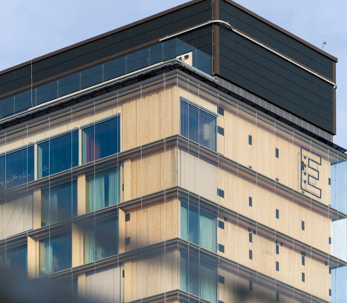 The facade of The Wood Hotel by Elite with the Elite Hotels and Miss Voon logos