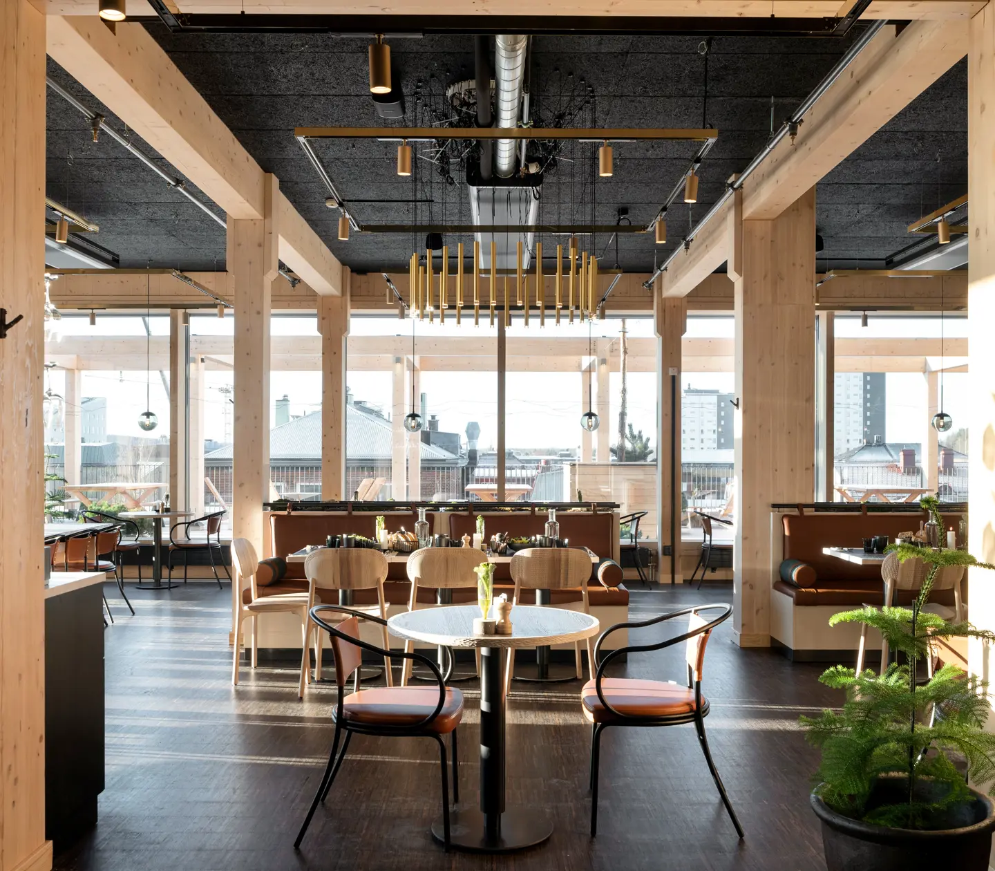 Restaurant environment with food groups, plants and ceiling lamp