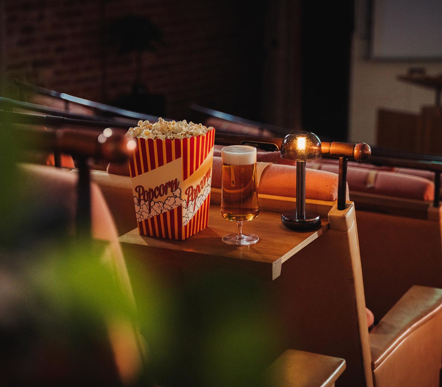 A cinema with popcorn and a beer