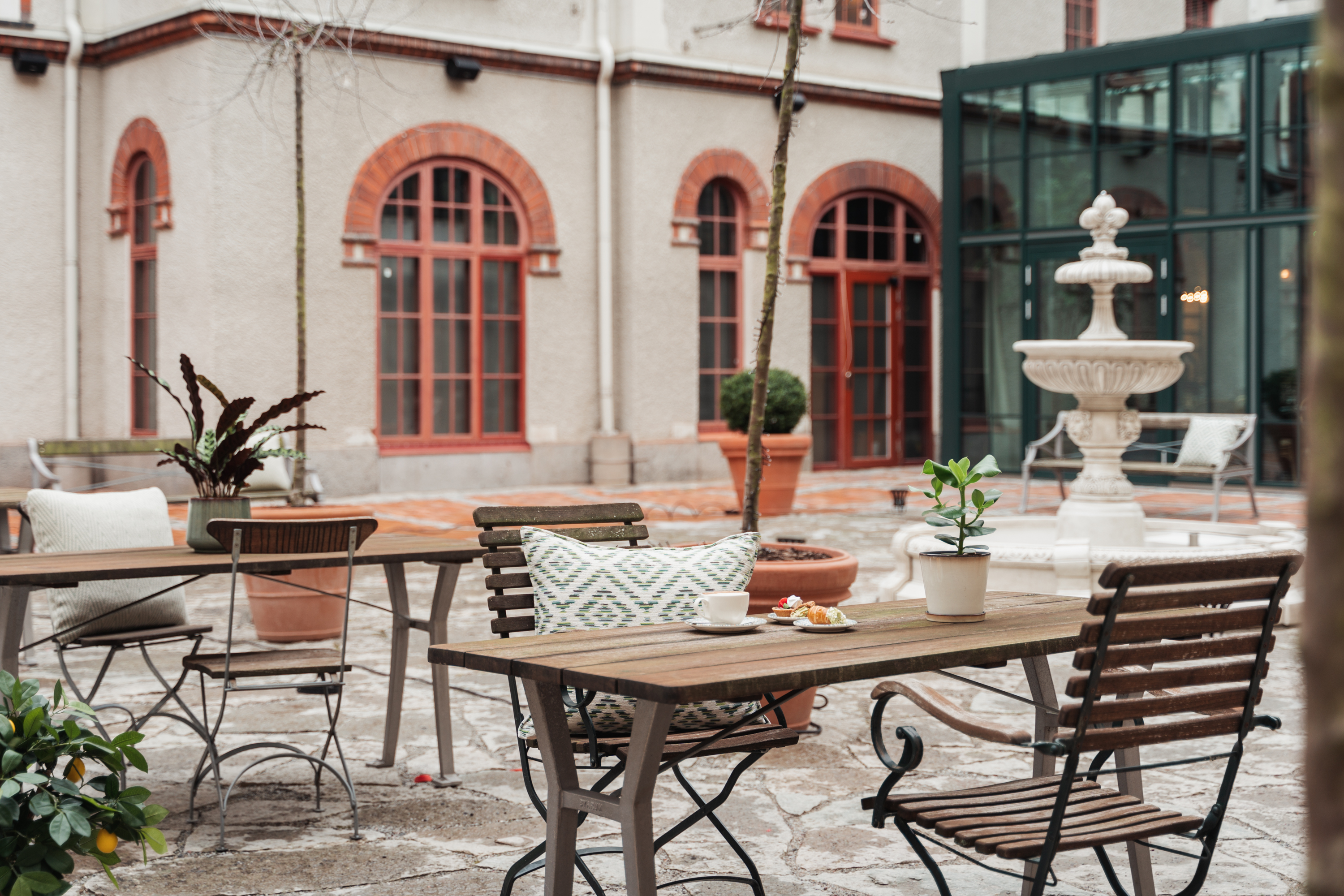 Outdoor seating with dining groups, fountains and plants