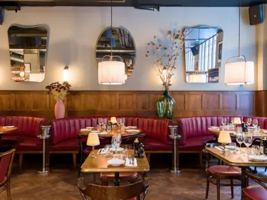 Fancy restaurant with red sofas