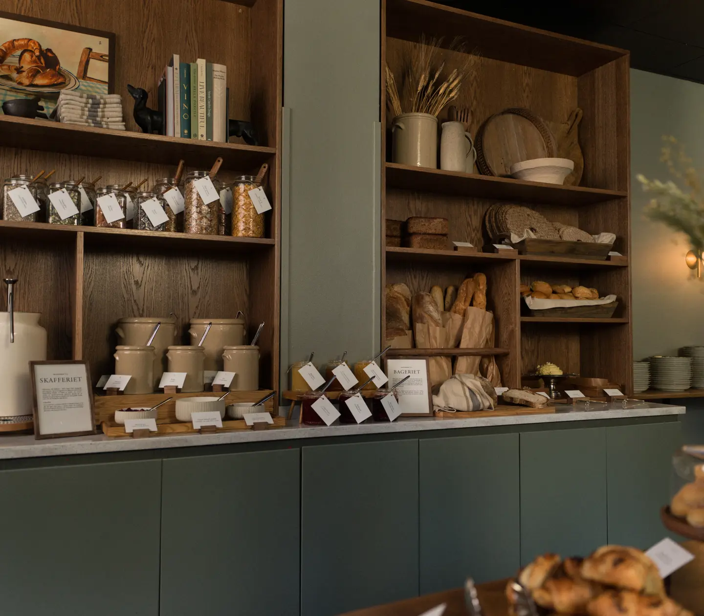 Restaurant environment with dining groups, blackboard and ceiling lights