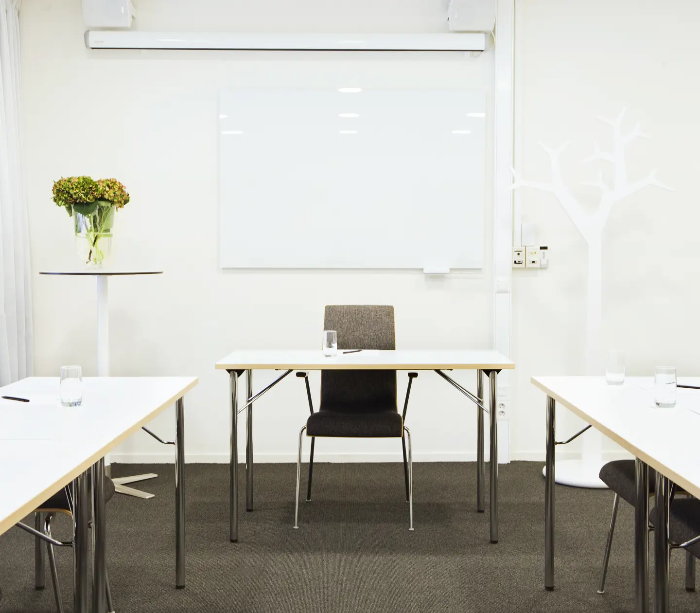 Conference room with chairs, table and bouquet