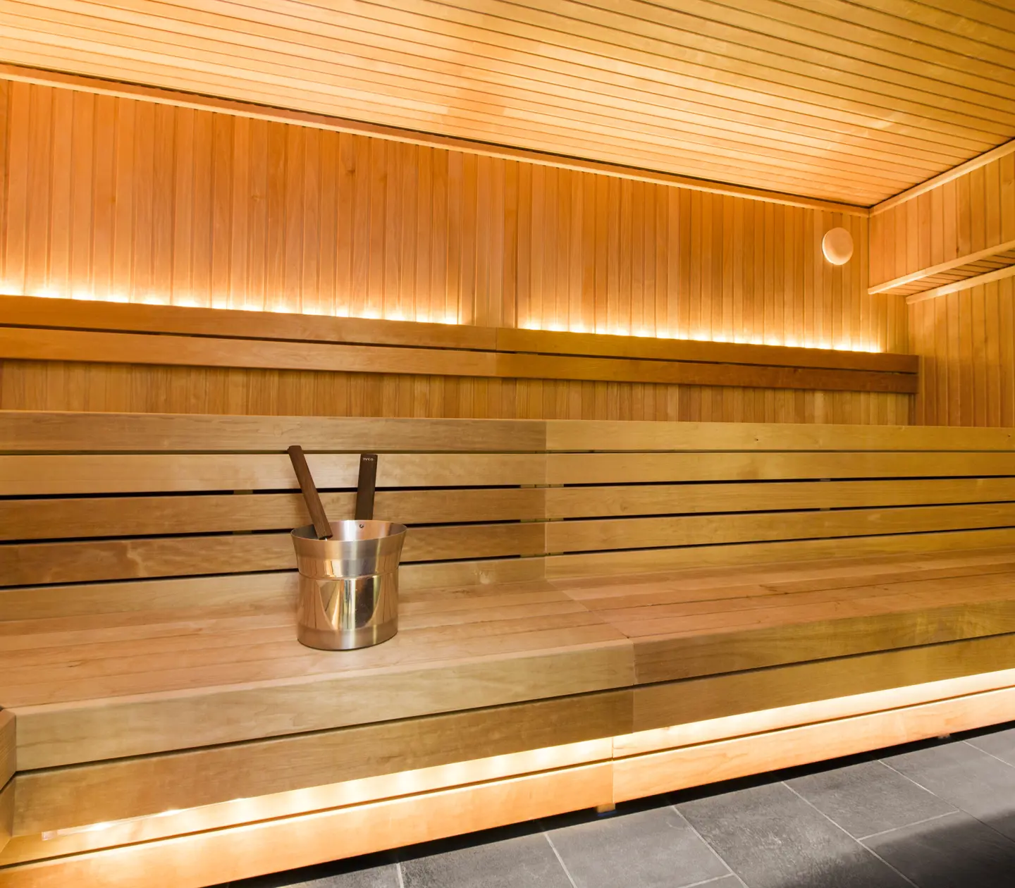 Sauna with lighting and bucket