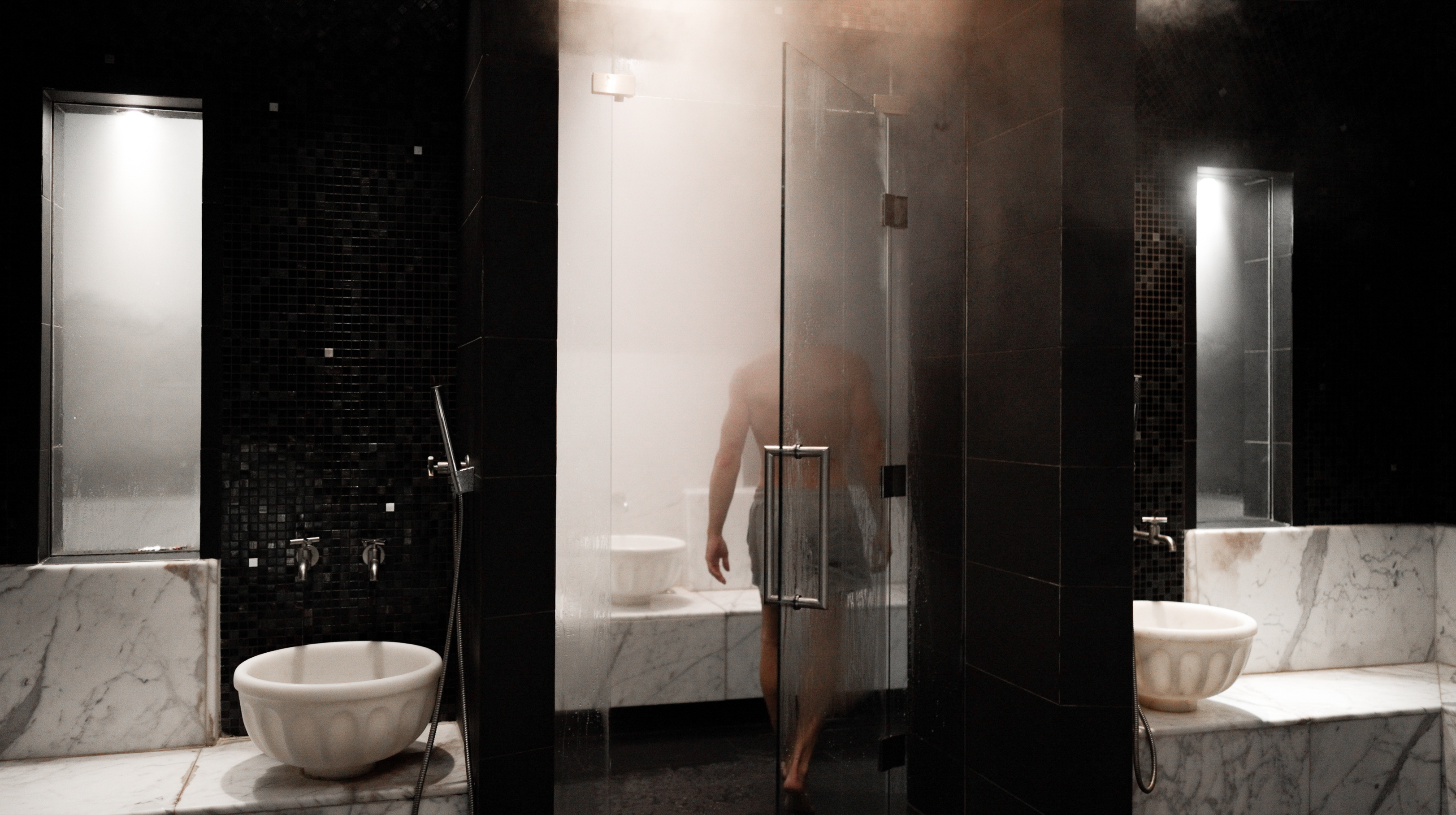 A large indoor pool in subdued lighting