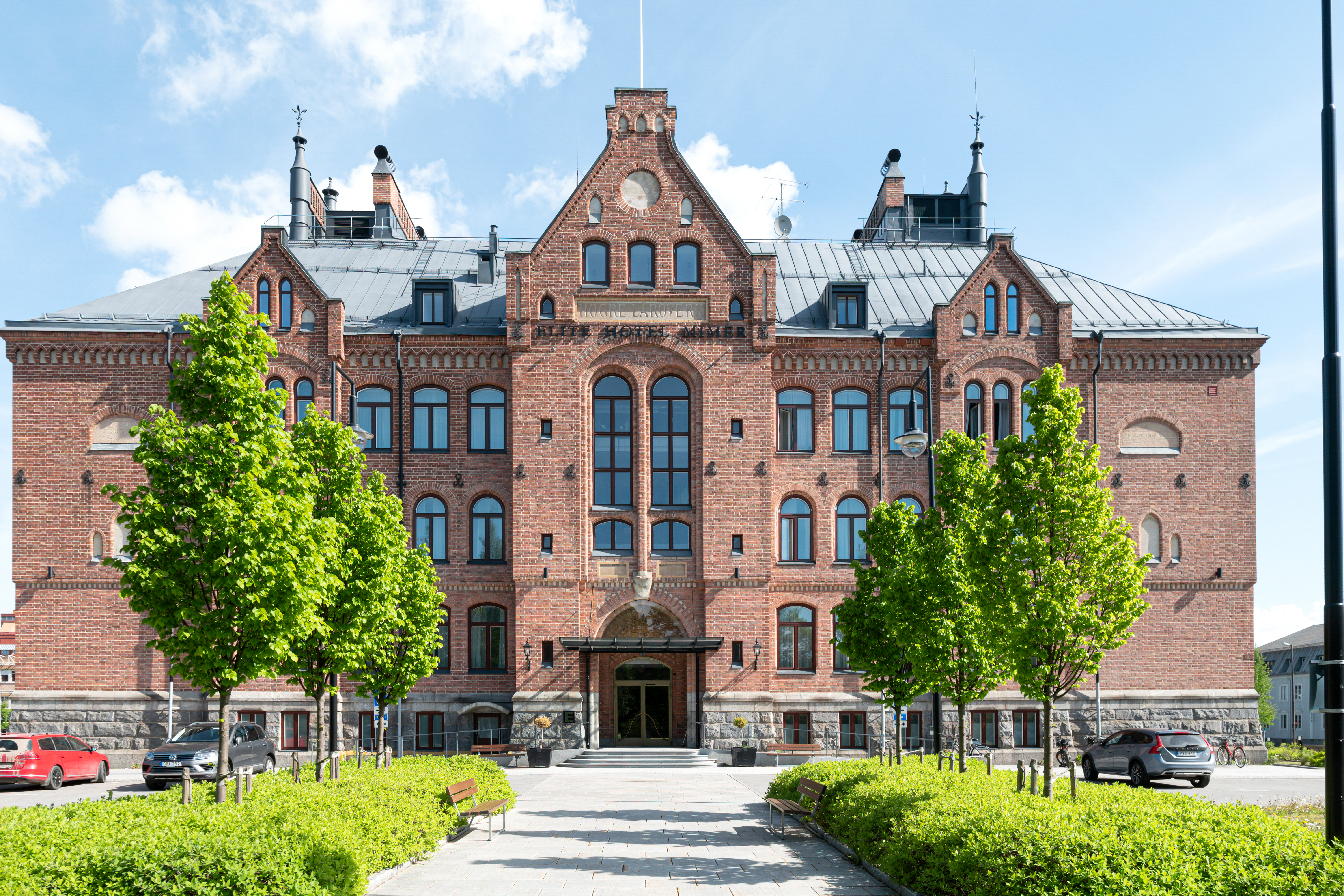 Large and grand building in light red bricks