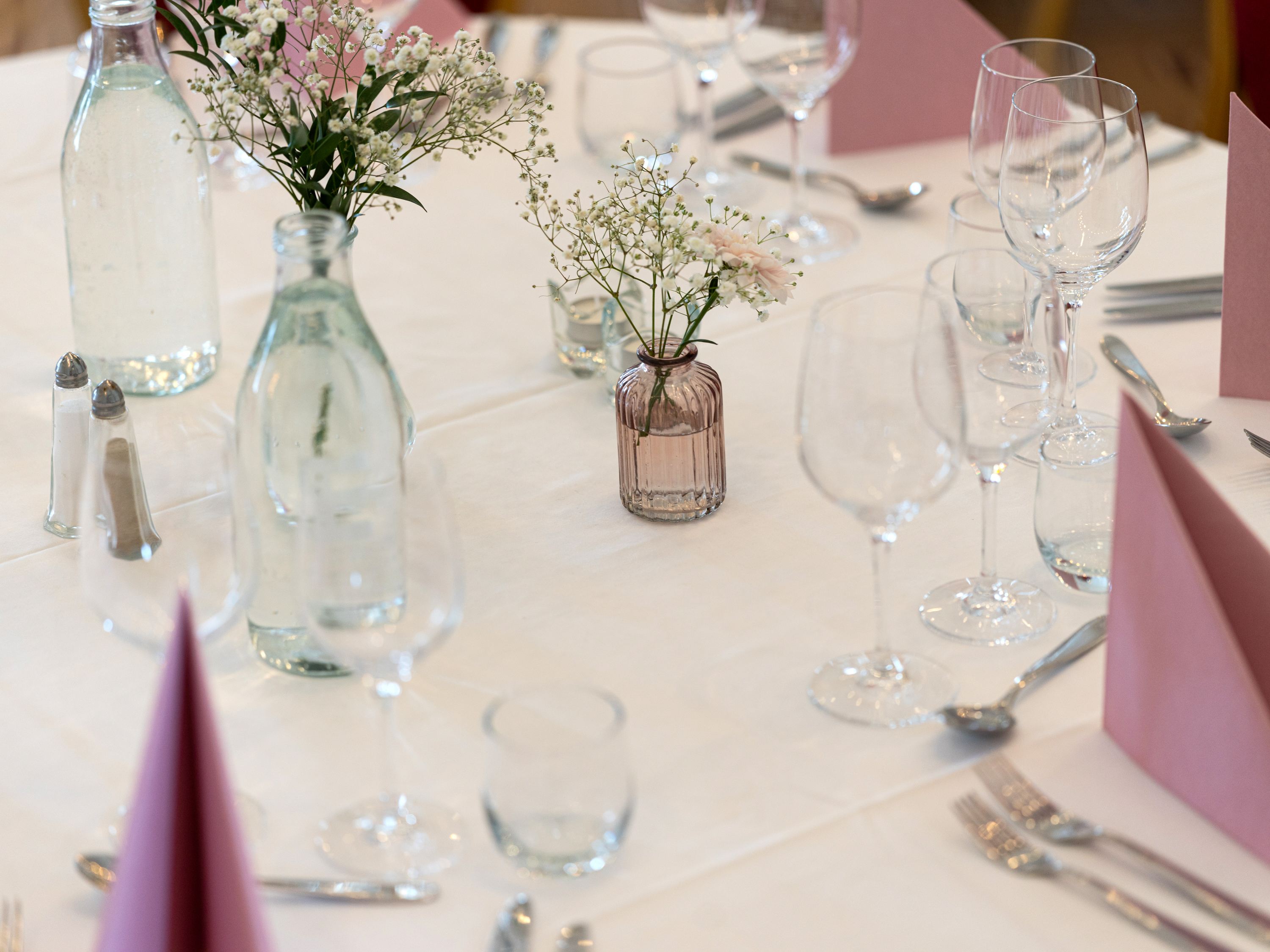 A couple holding a glass of champagne