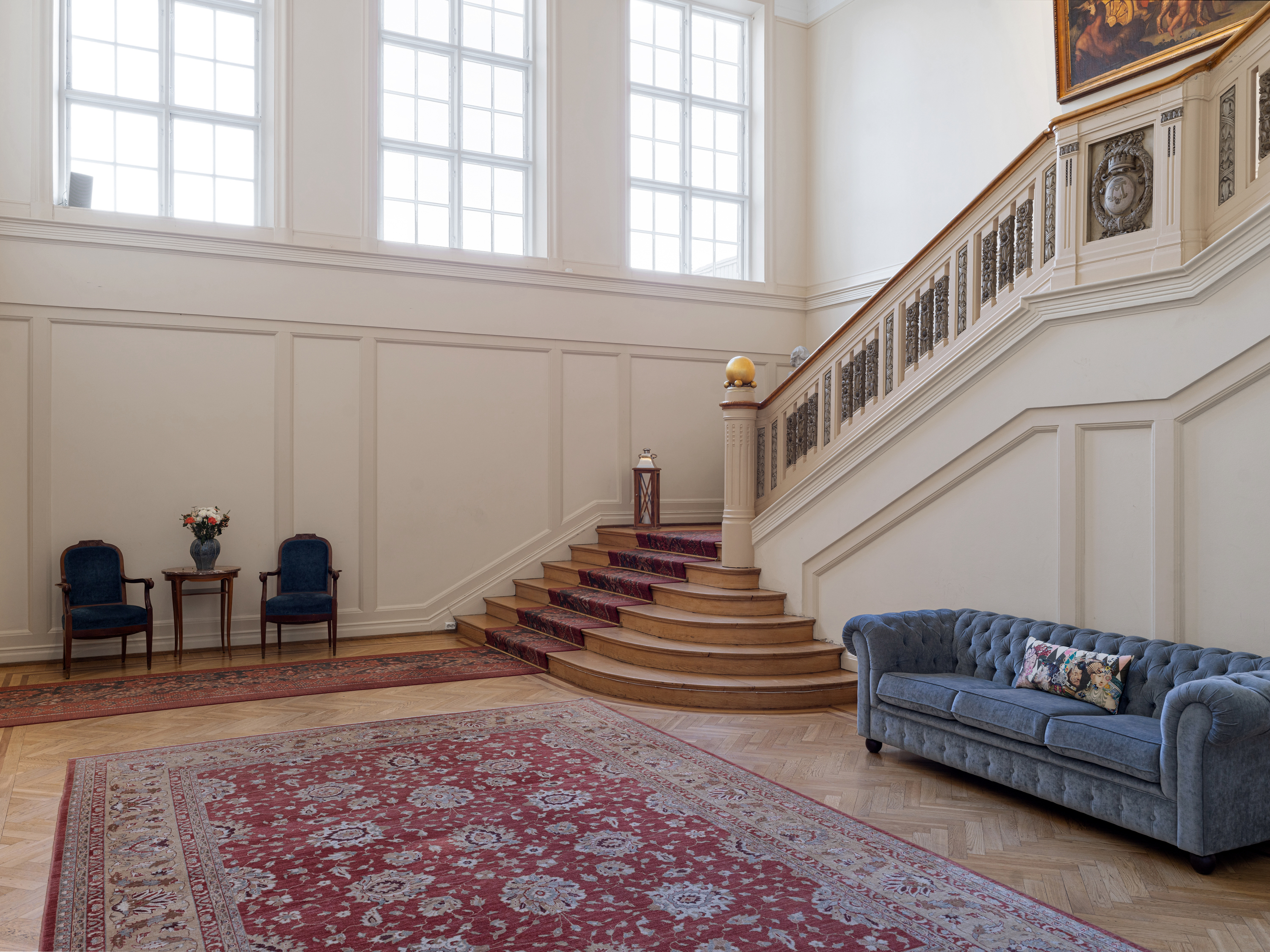 Stairs that divide with black railing