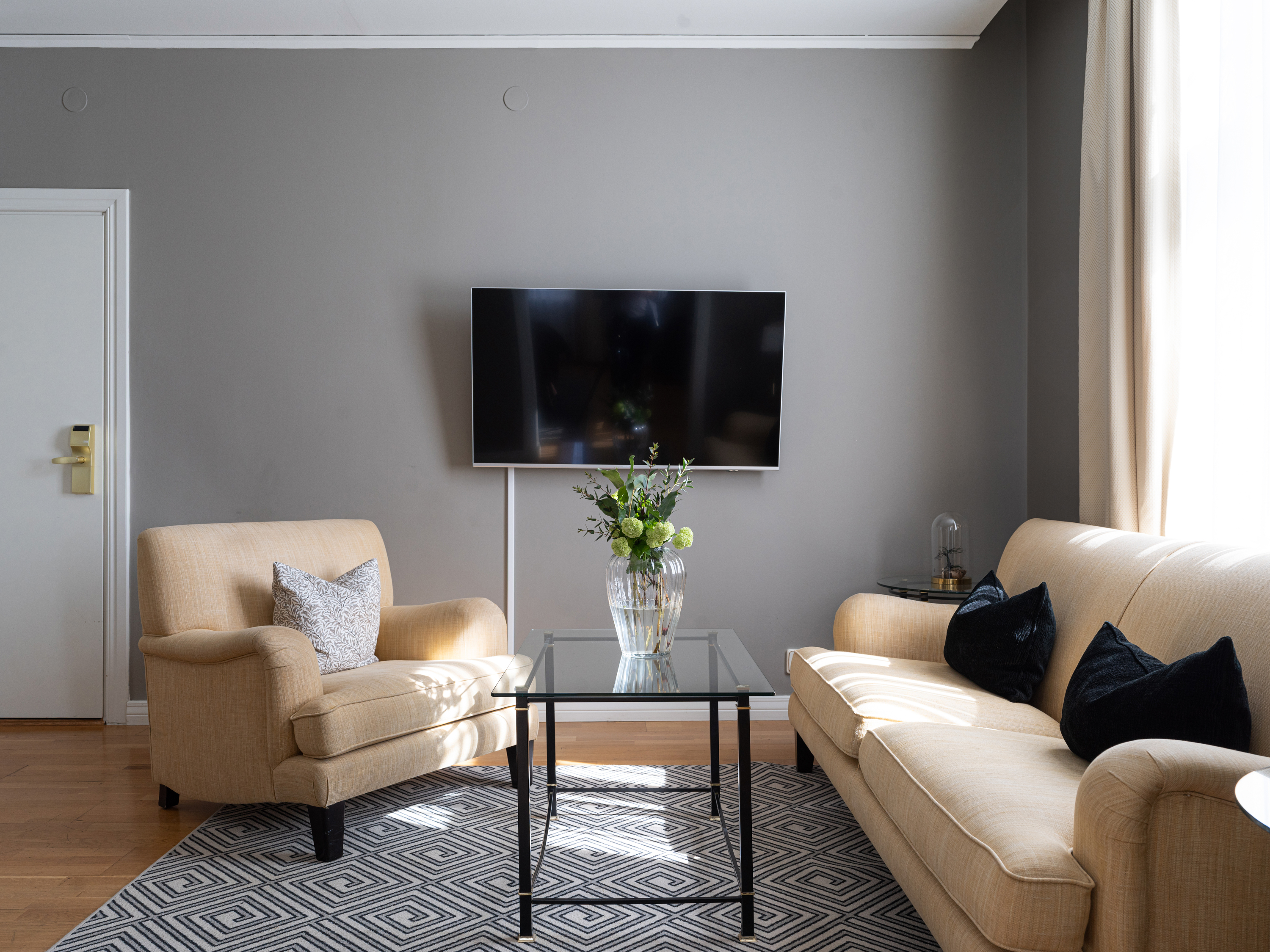 Hotel room with a large bed and a window next to it