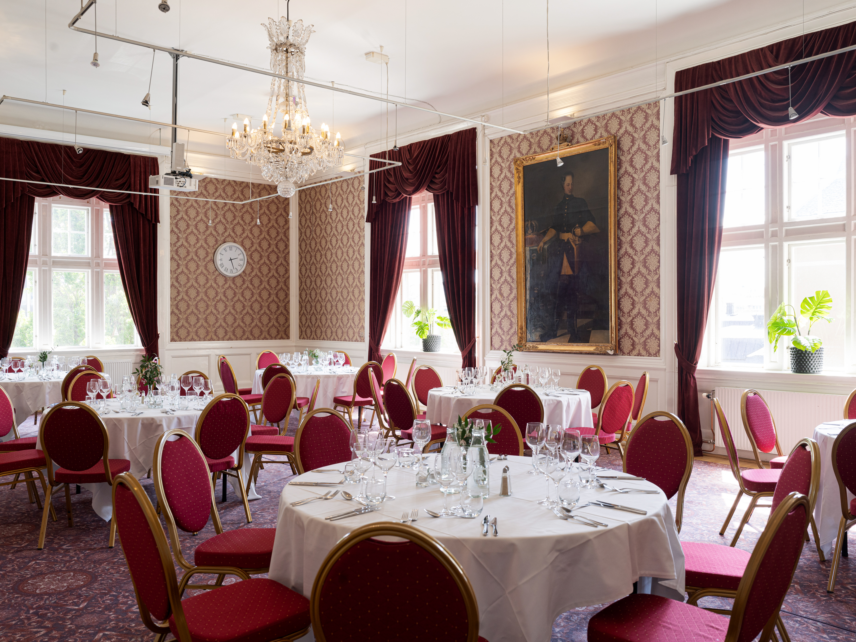 A large and elegant conference with red interior and details