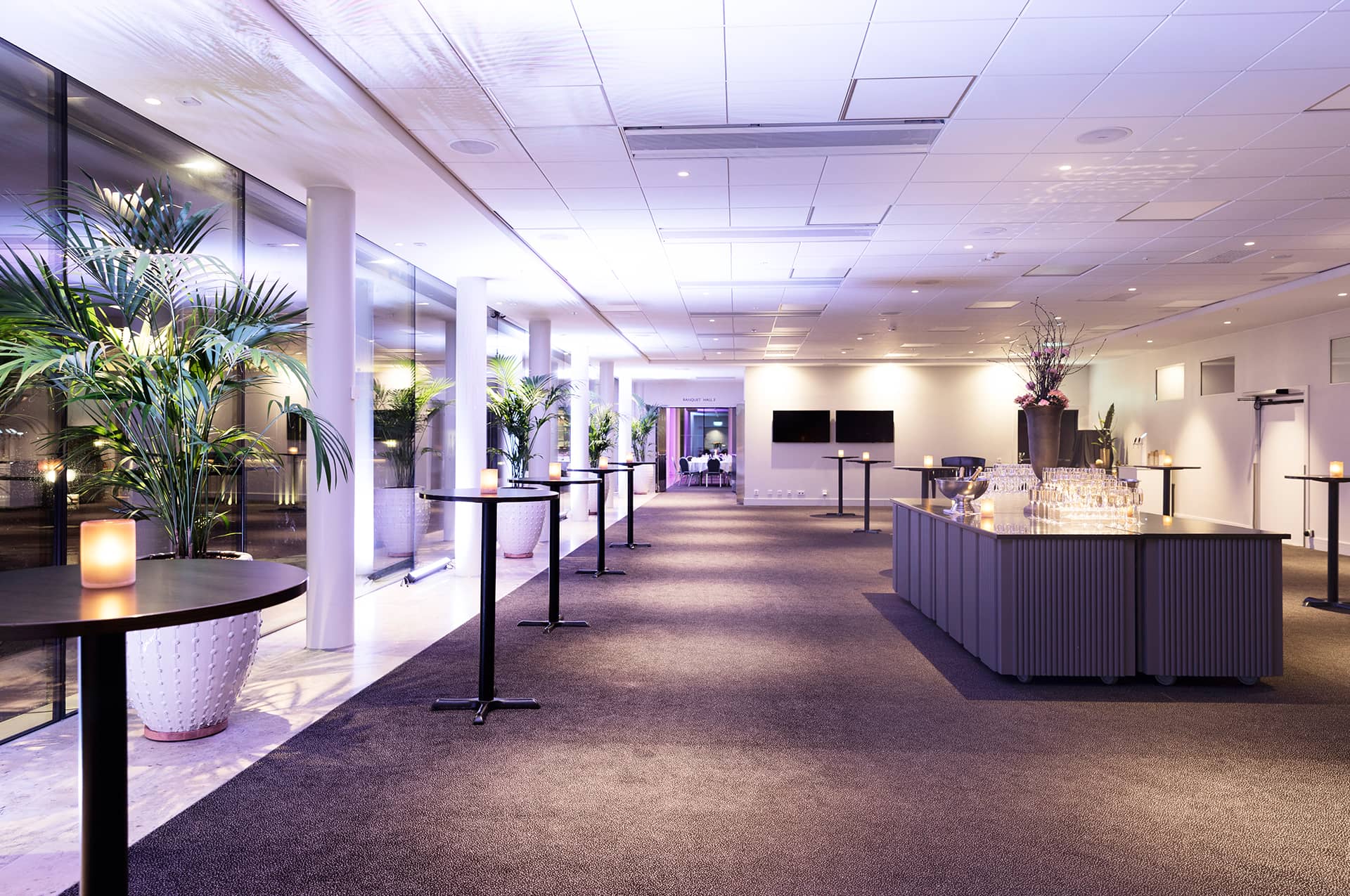 A spacious lobby with high tables