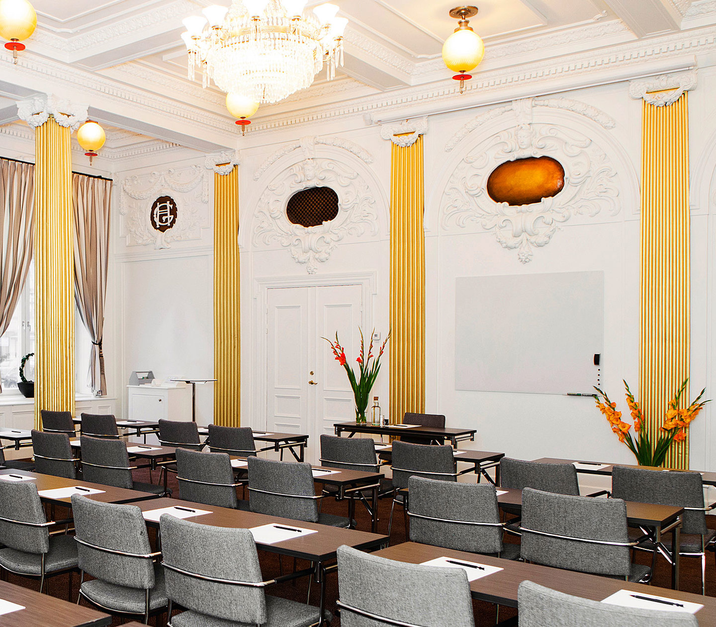 Conference room with stucco and crystal chandelier