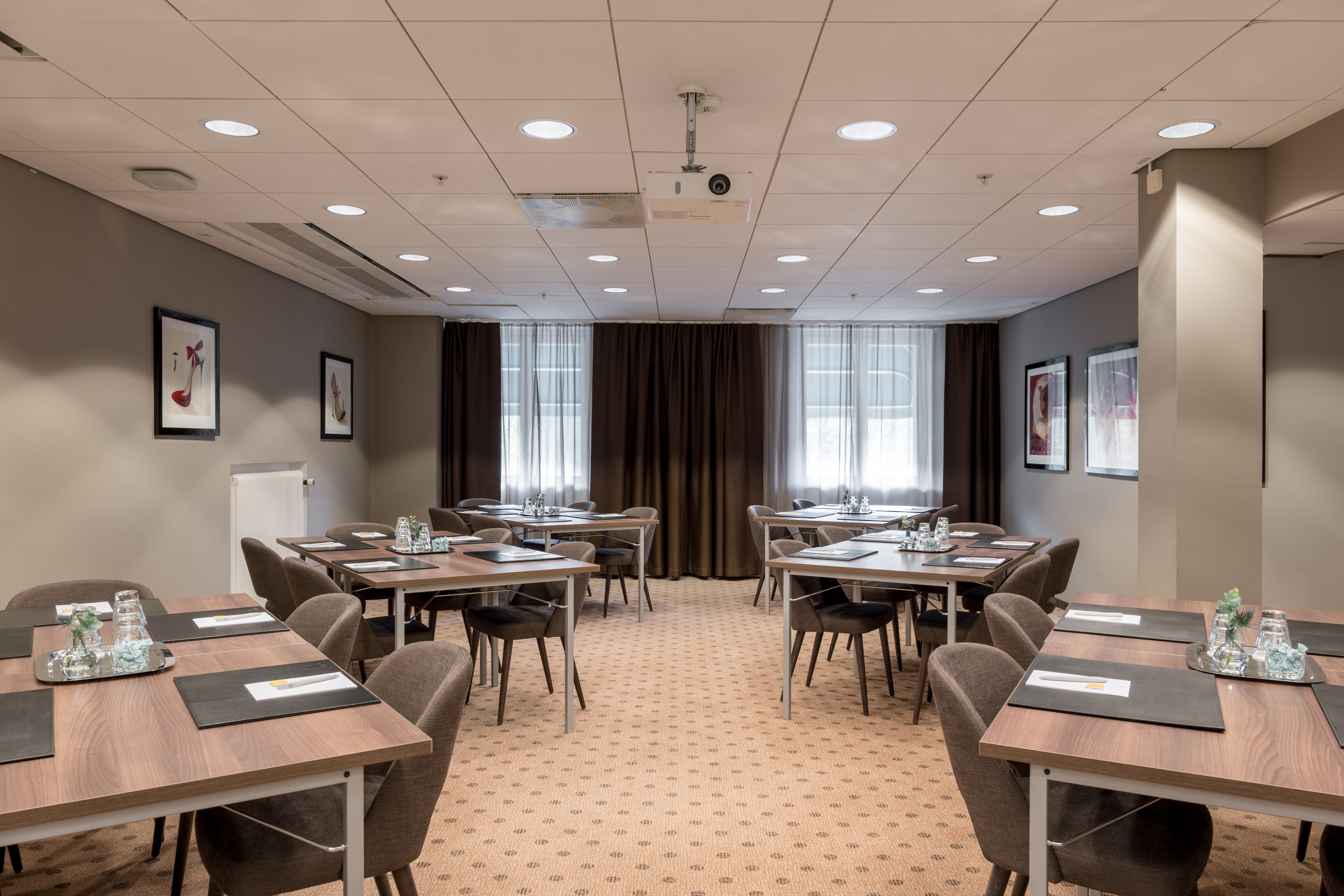 Nice conference room with multiple tables, chairs, and windows.