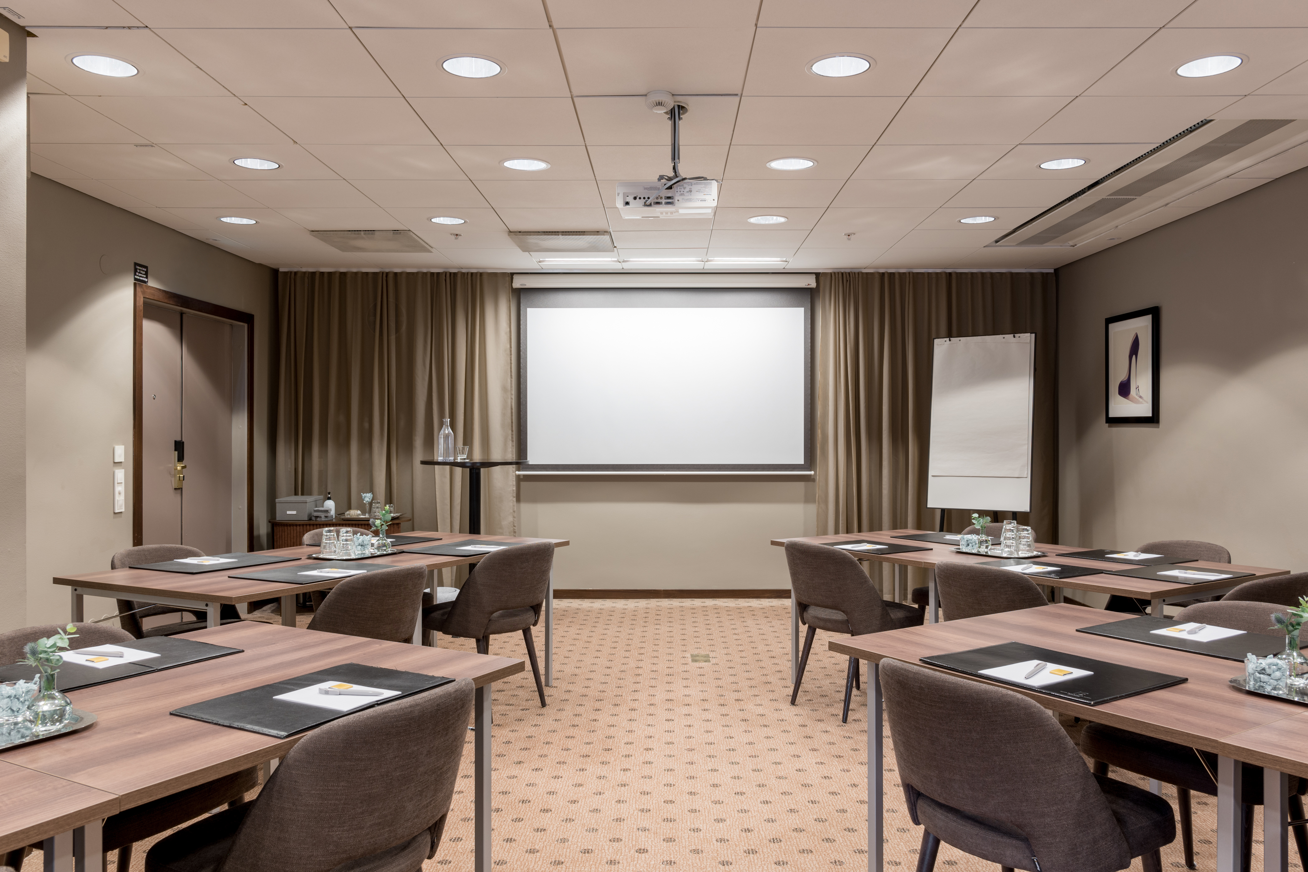 Nice conference room with multiple tables, chairs, and a whiteboard