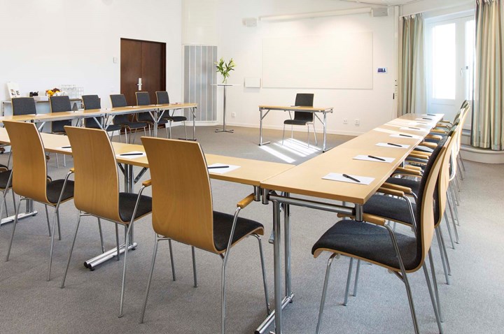 Conference room with u-shaped seating and light walls