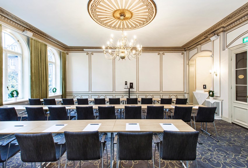 Conference room with table, chairs and large windows
