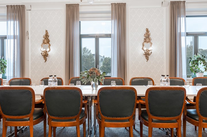 Conference room with board seating and large windows