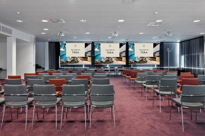 Conference room with chairs lined up in cinema seating