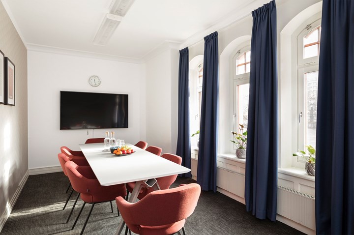 Conference room with board seating and large windows