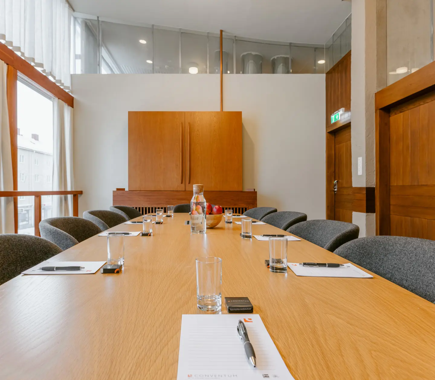 Board room with green carpet and large windows