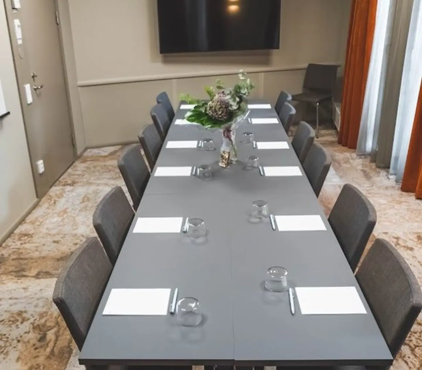 Gray conferens table with pad and pen