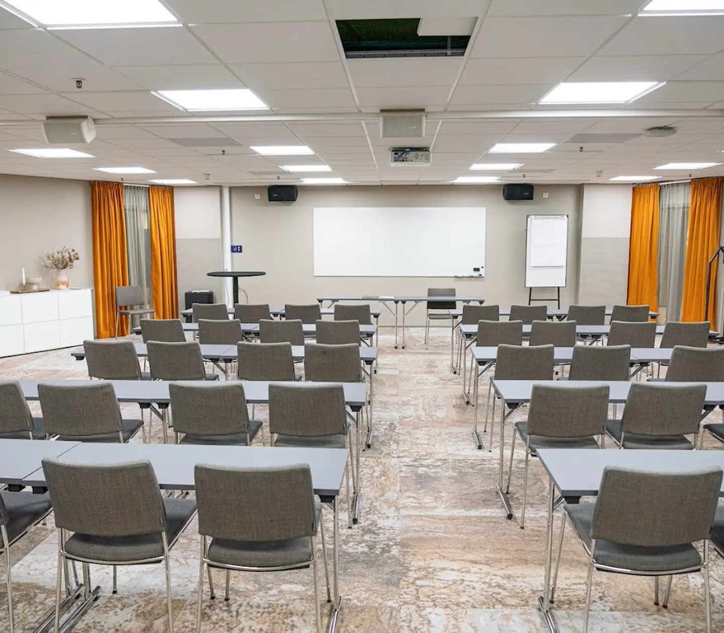 Conference room with lined up gray chairs