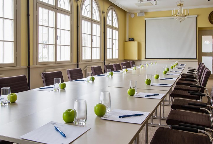 Conference room with board seating and large windows
