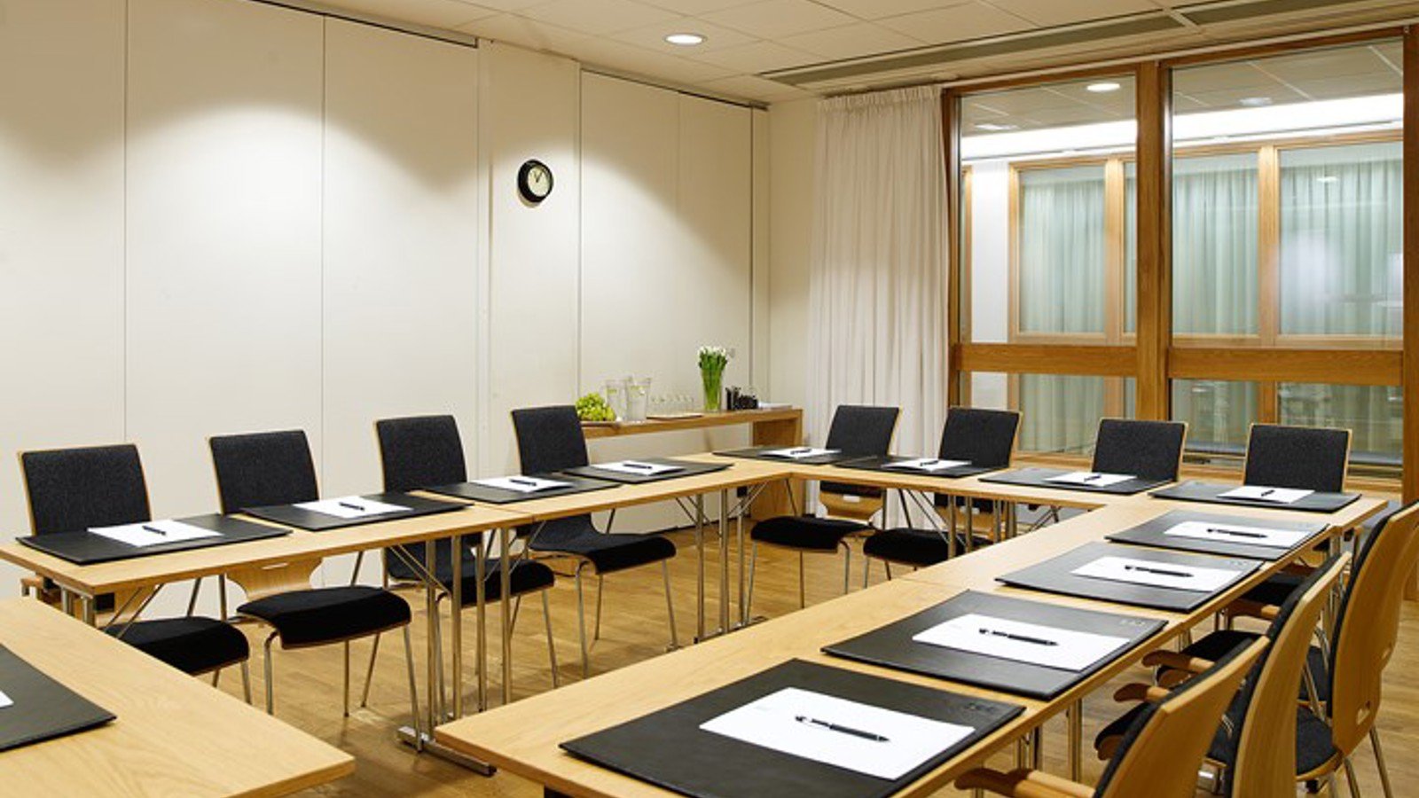 White conference room with U-shaped seating