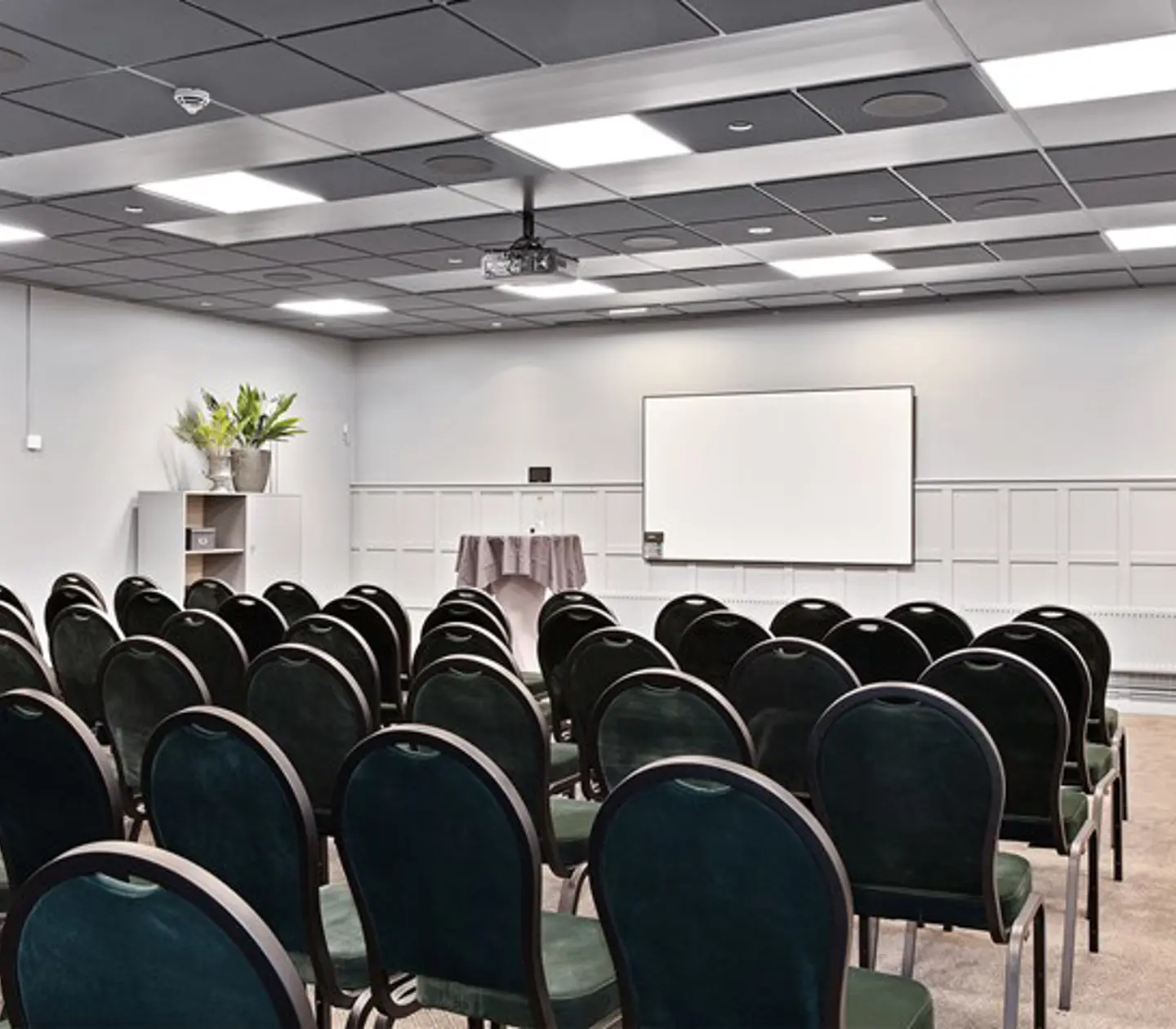 Bright conference room with cinema seating