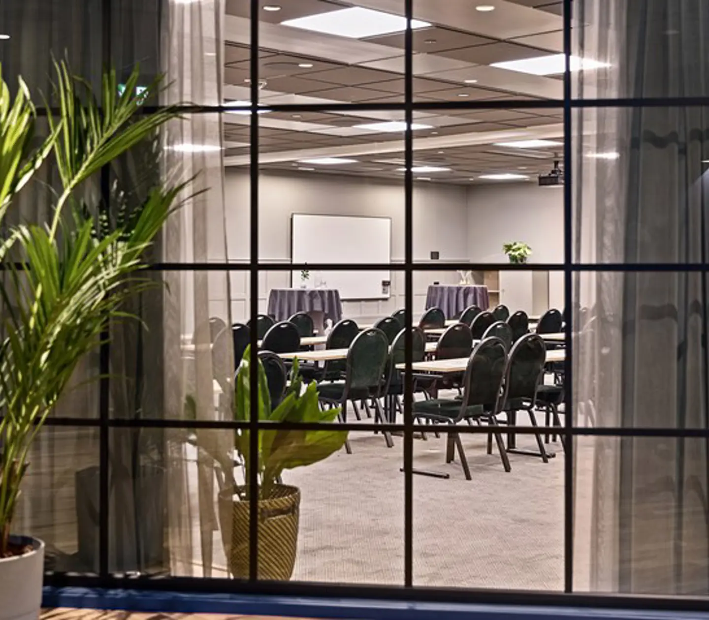 Conference room with chairs photographed through a window