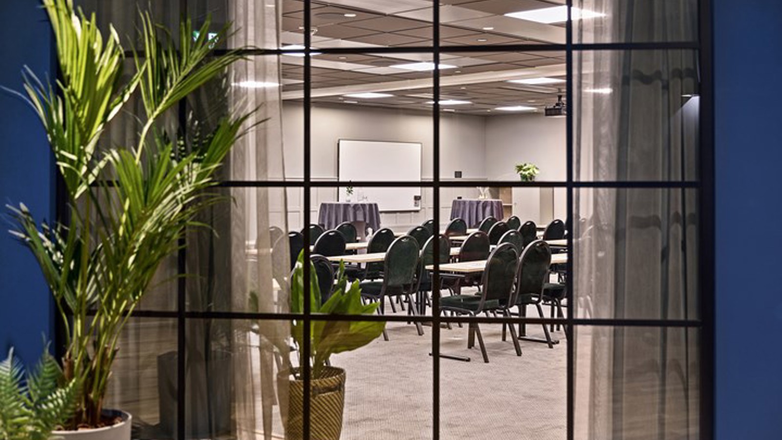 Conference room with chairs photographed through a window