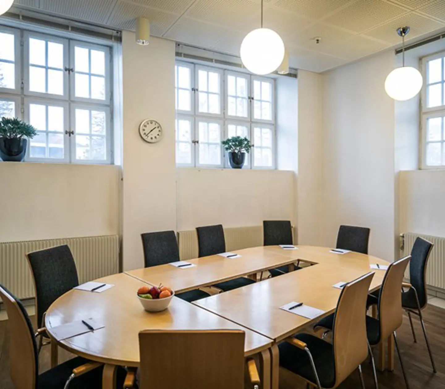 Conference room with board seating and large windows